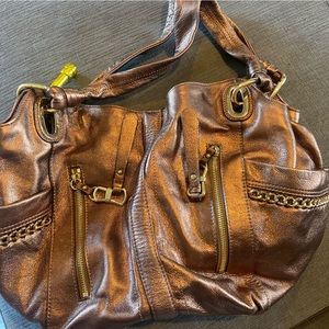 B. Makowski gold leather shoulder bag, with sleeper bag.